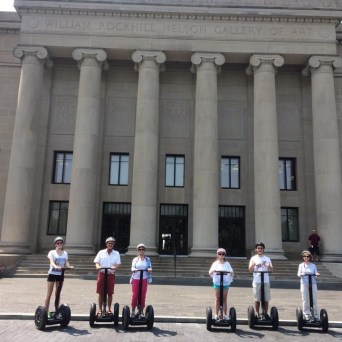 family riding their segway to William Rockhill Nelson Gallery of Art