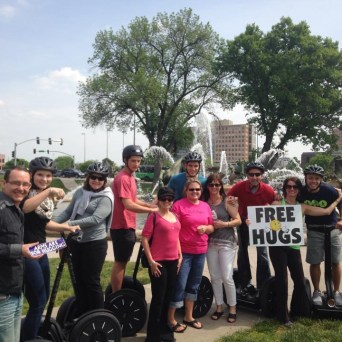 a group of people holding a sign saying 