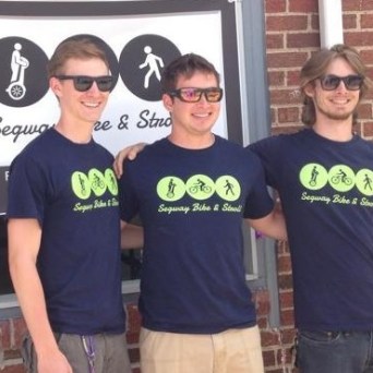 three guys wearing segway bike & stroll shirts