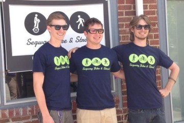 three guys wearing segway bike & stroll shirts
